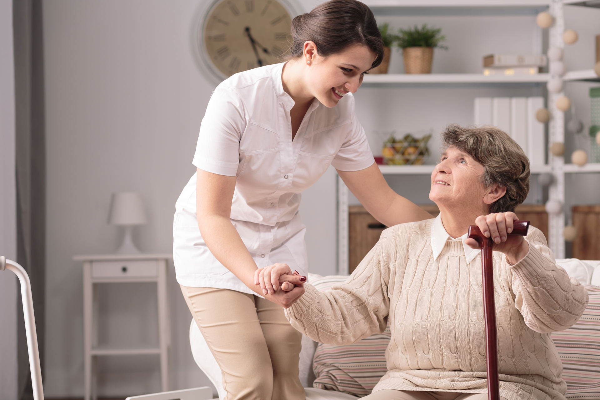 San Antonio home care worker helping lady stand up | Home to Home for Seniors San Antonio Senior Living and Assisted Living Advisor and Retirement Community Advisor and Locator Service