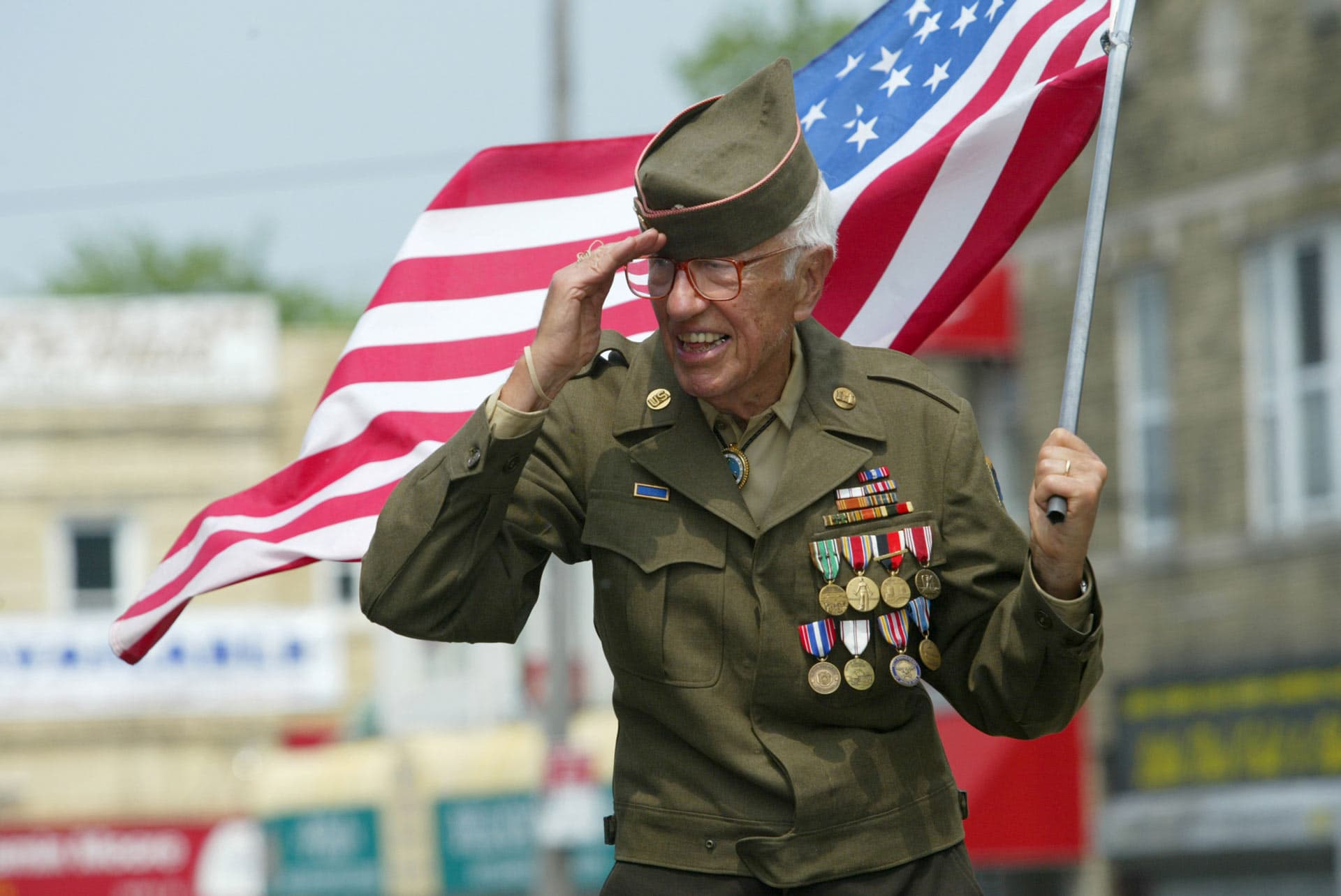 San Antonio veteran holding an American flag